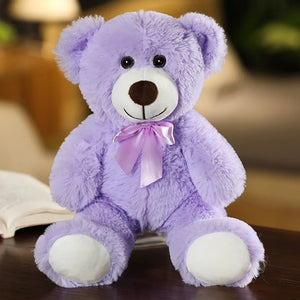 plush teddy bear wearing a bow tie
