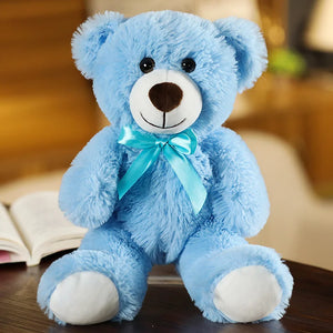 plush teddy bear wearing a bow tie