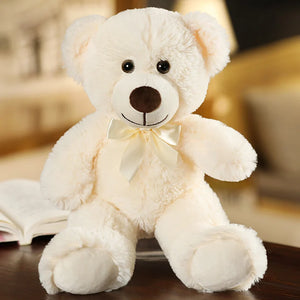 plush teddy bear wearing a bow tie