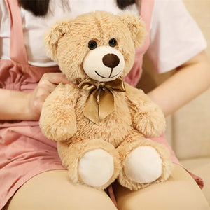 plush teddy bear wearing a bow tie