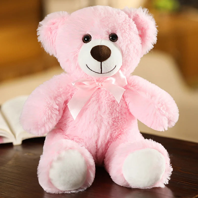 plush teddy bear wearing a bow tie