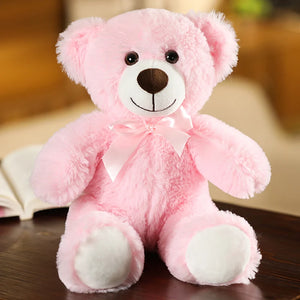 plush teddy bear wearing a bow tie