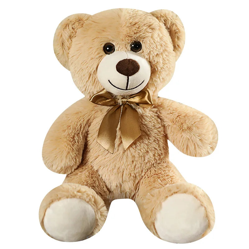 plush teddy bear wearing a bow tie