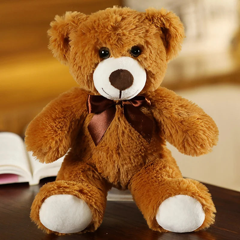 plush teddy bear wearing a bow tie