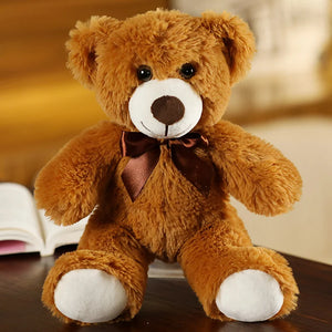 plush teddy bear wearing a bow tie