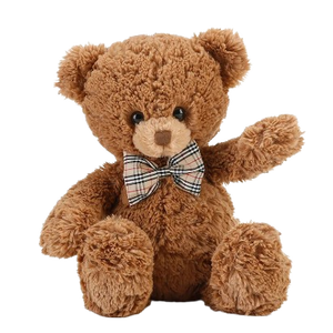 soft teddy bear wearing a bow tie