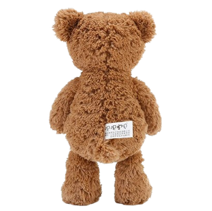 soft teddy bear wearing a bow tie